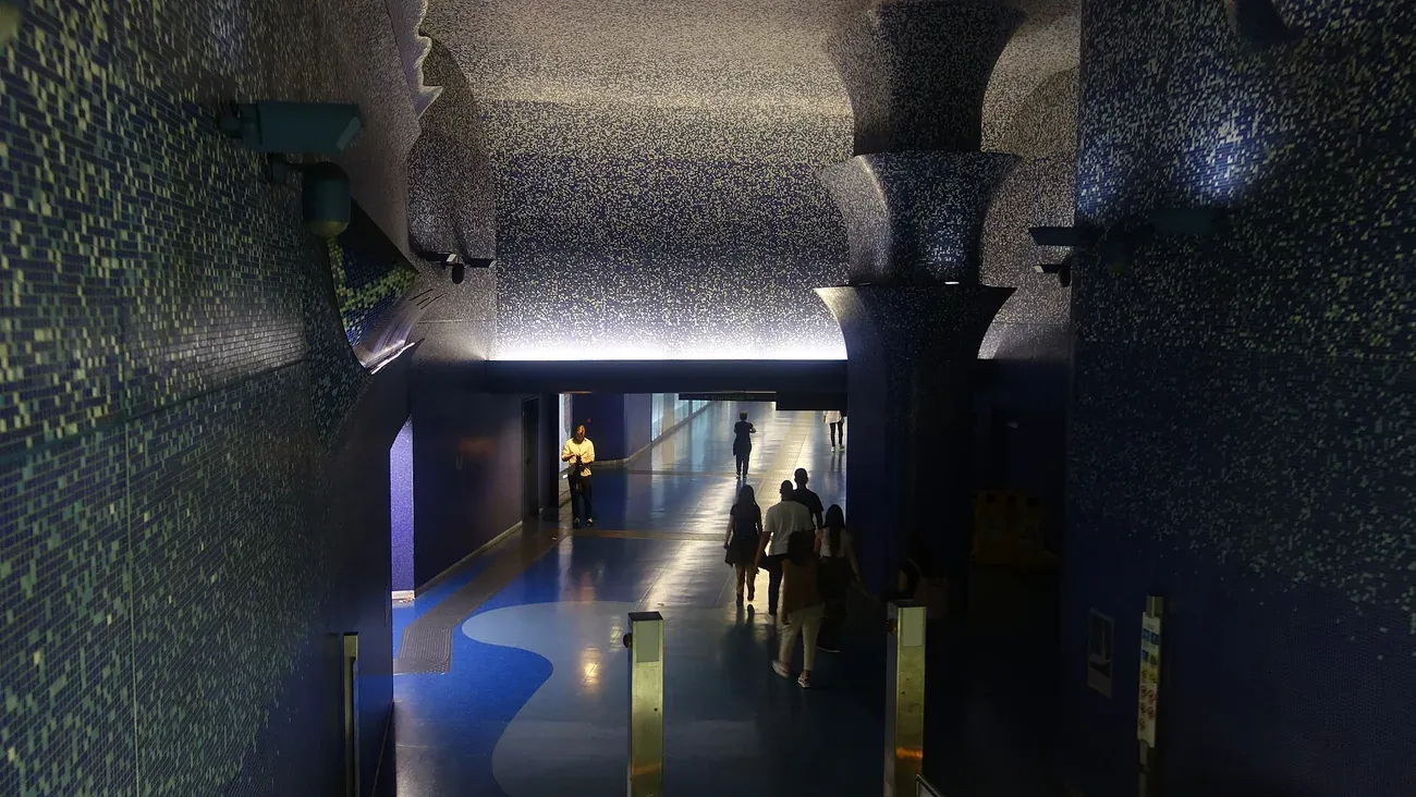 The deep-blue mosaic ceiling and columns of the mezzanine at Toledo metro station in Naples