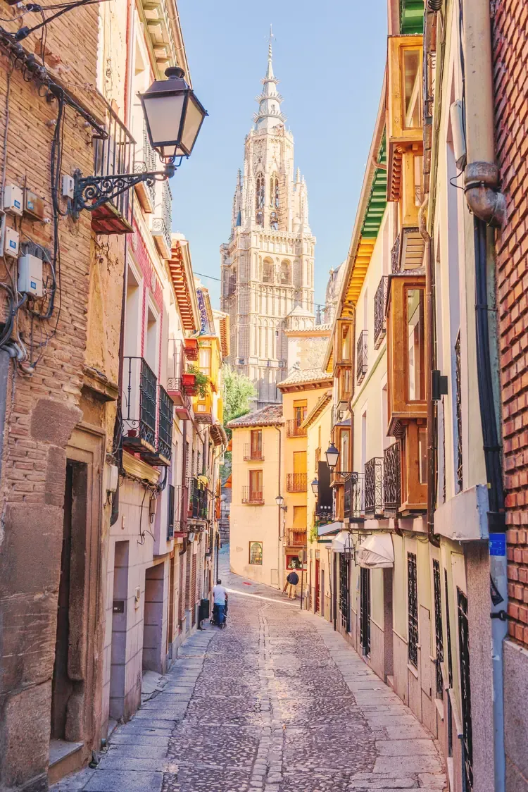 Narrow alleyway leading toward Toledo Cathedral, Toledo, Spain
