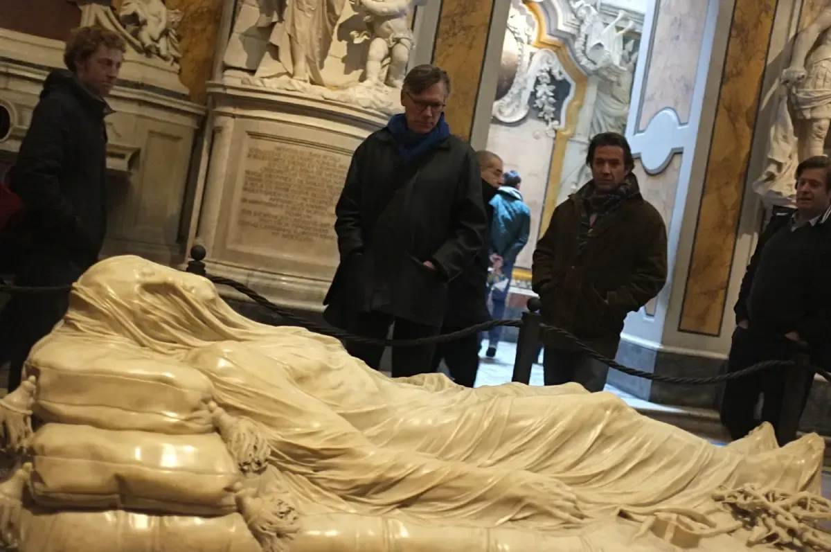 Tourists observing "The Veiled Christ"