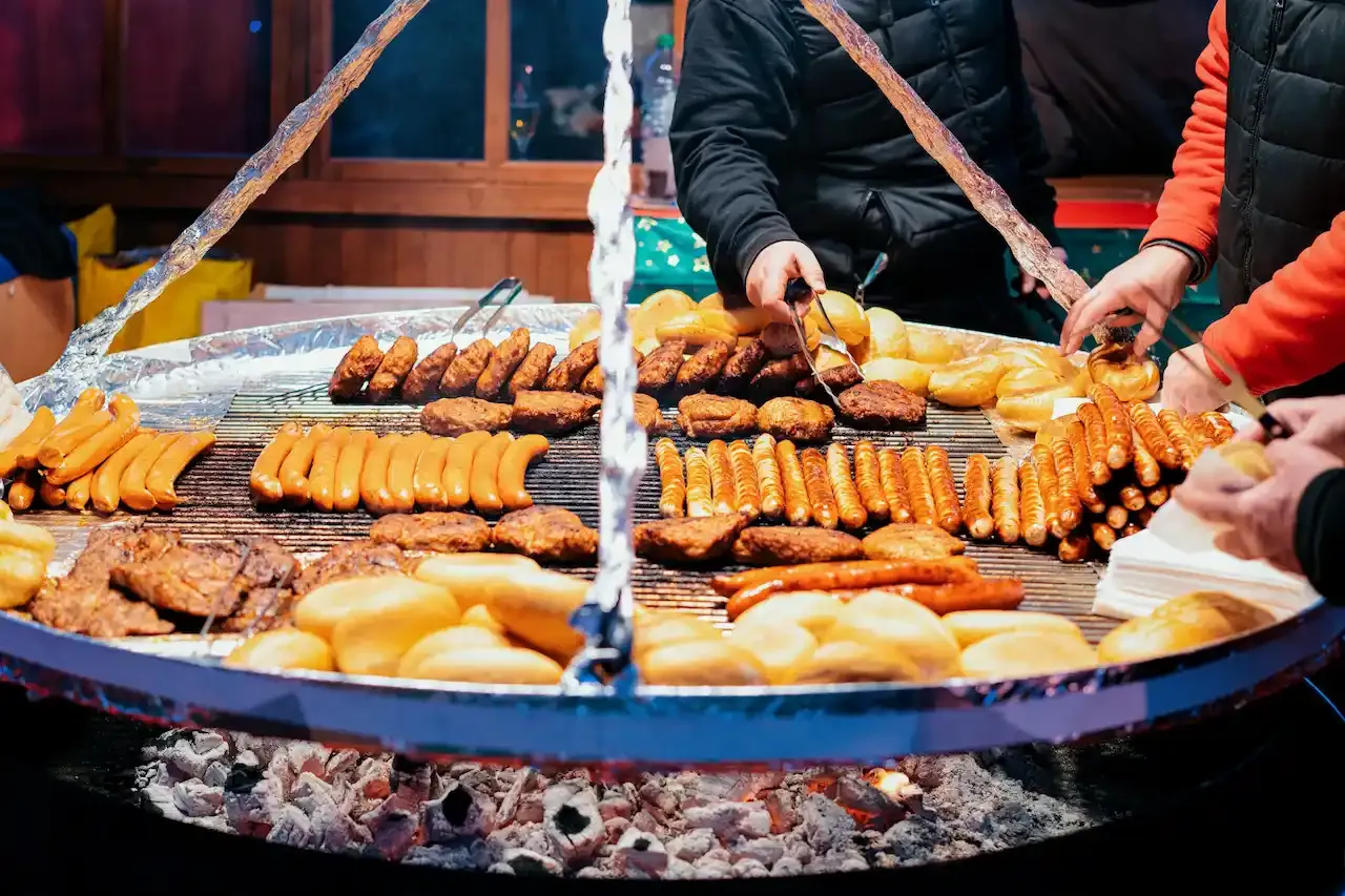 Traditional German sausages, meat patties, and bread rolls