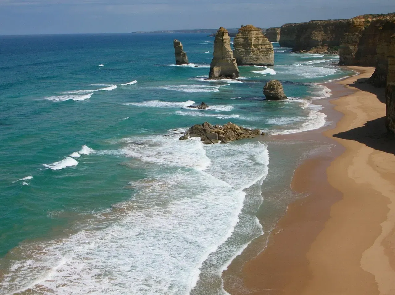 Limestone stacks of the Twelve Apostles rising from the surf on the Great Ocean Road