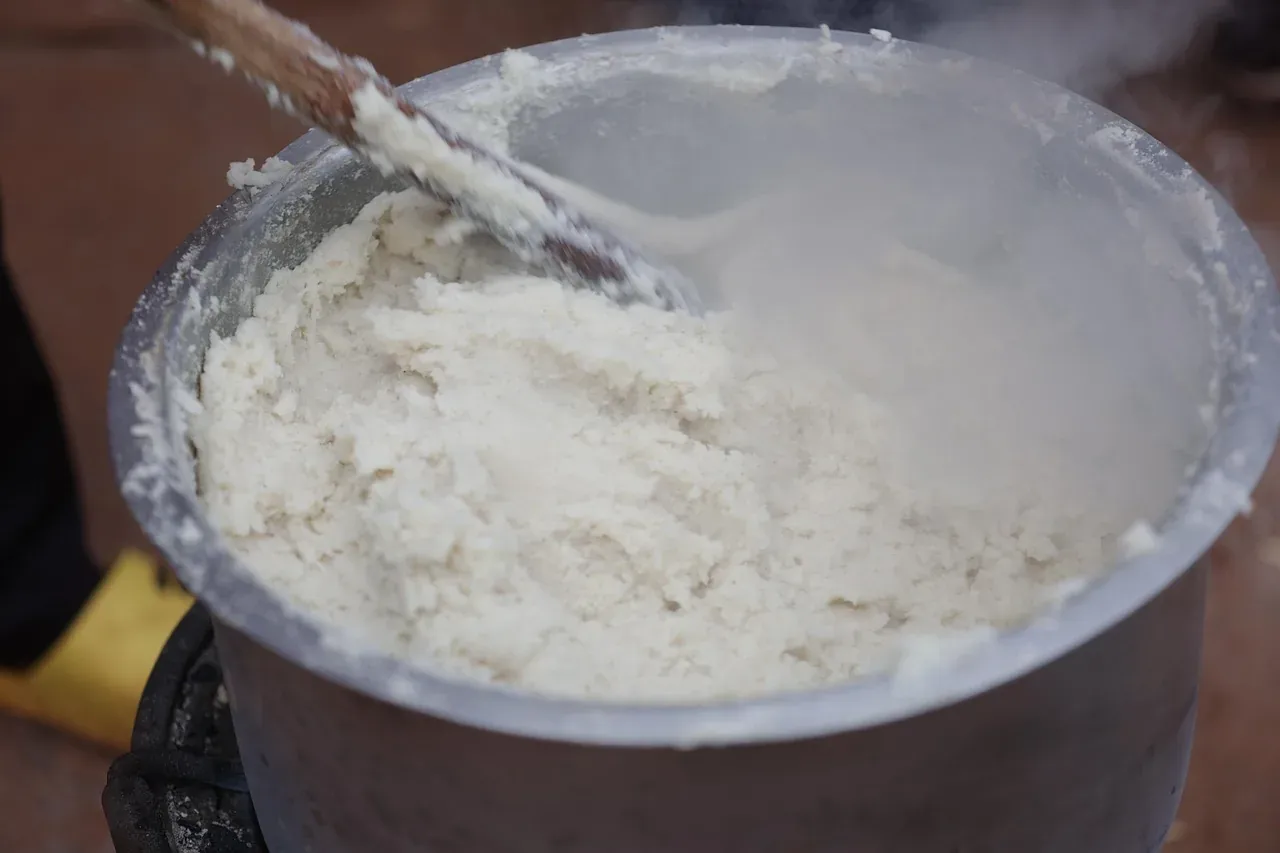 Ugali, stiff maize porridge, being stirred in a pot in Kenya
