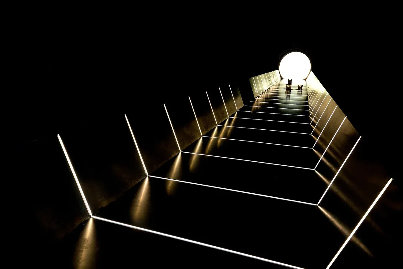 A lit stairway inside the underground galleries of MONA in Hobart