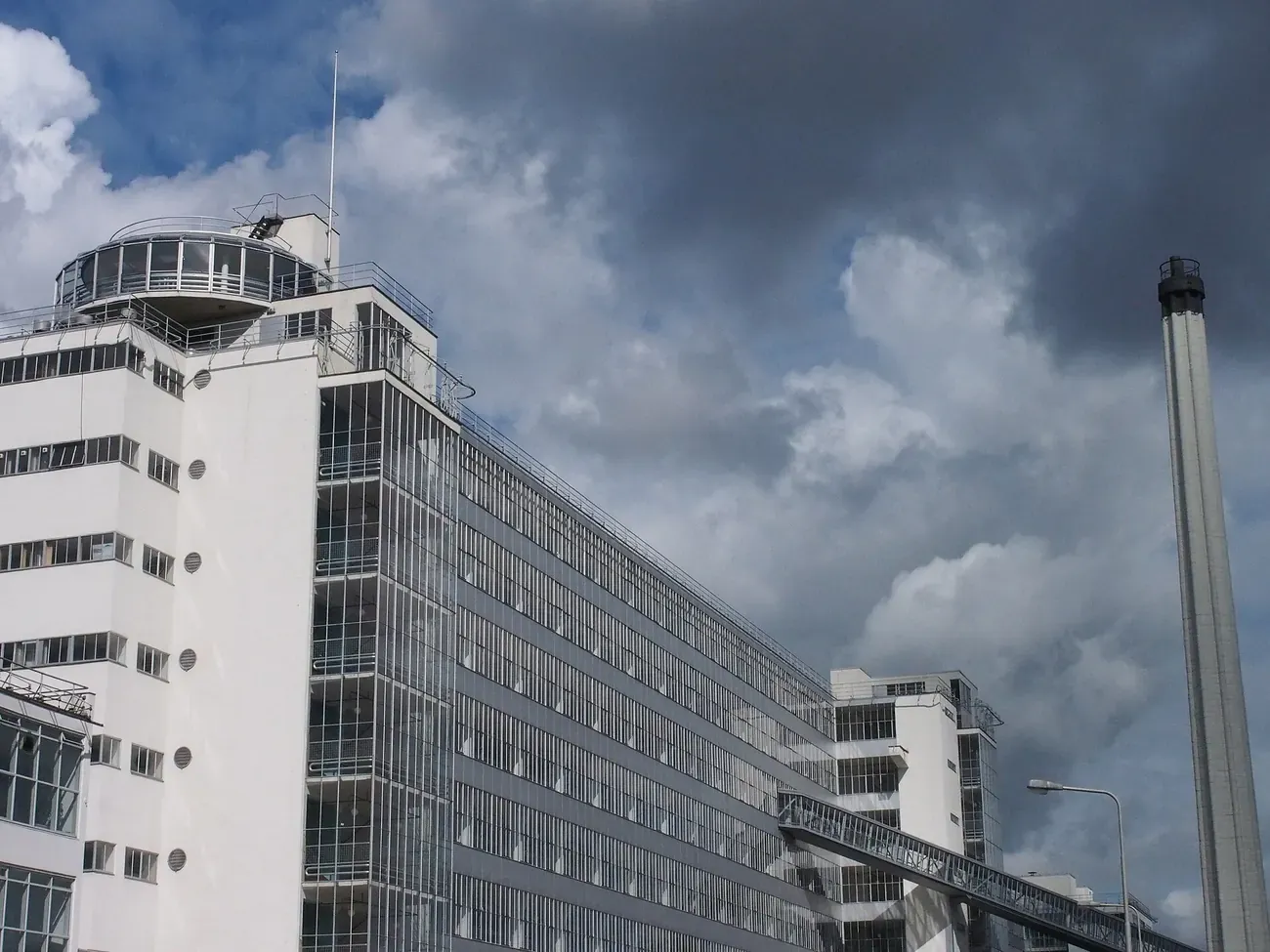 The glass and steel frontage of the former Van Nelle Factory beside the Schie in Rotterdam