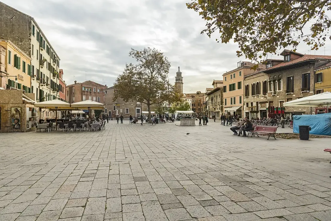 Campo Santa Margherita square with cafe tables and surrounding houses in Dorsoduro, Venice