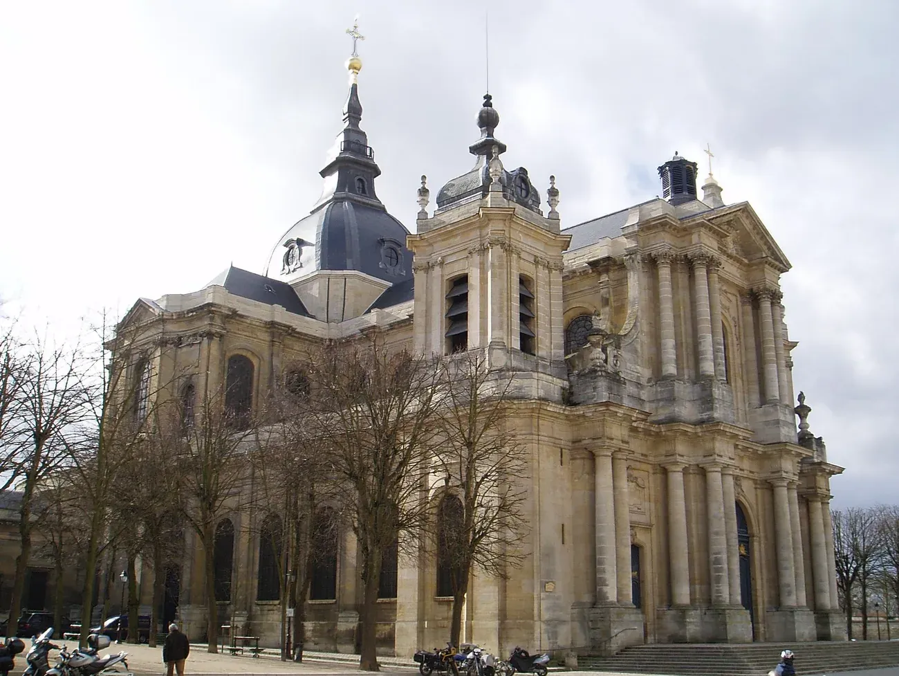 The Rococo exterior of the Cathedrale Saint-Louis in Versailles, showing its twin domes and corner bell towers