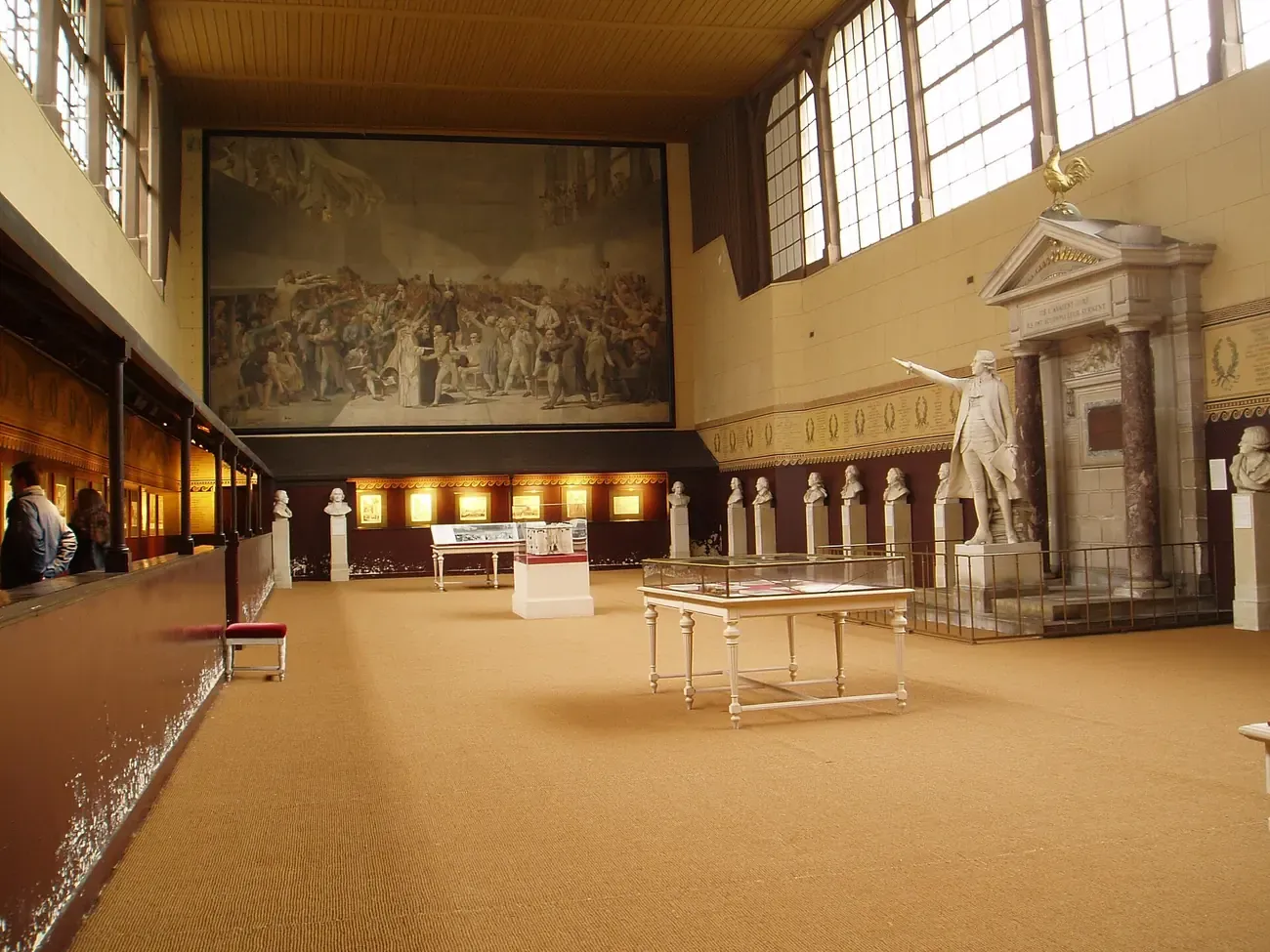 Interior of the Salle du Jeu de Paume in Versailles, with the Tennis Court Oath mural and the statue of Jean Sylvain Bailly