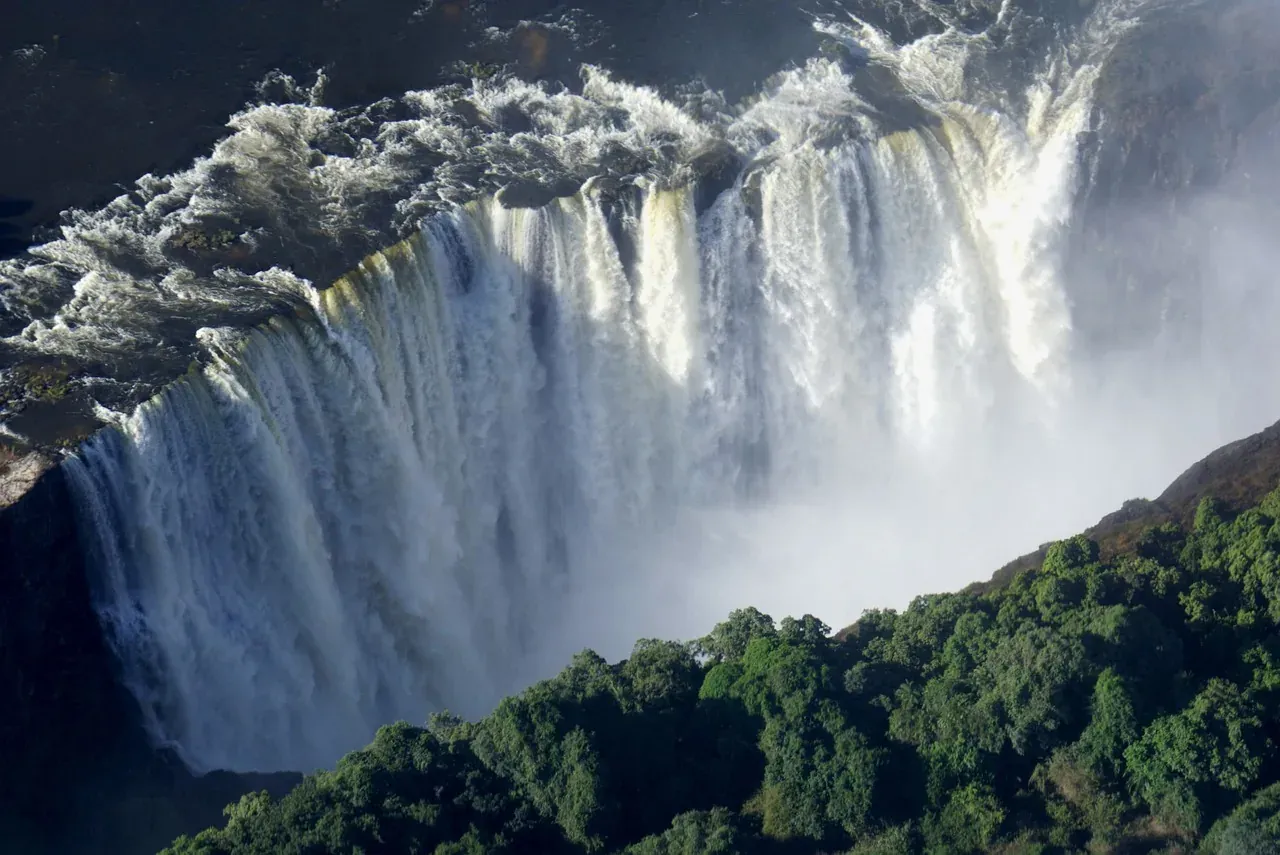 Aerial view of Victoria Falls dropping into the Zambezi gorge