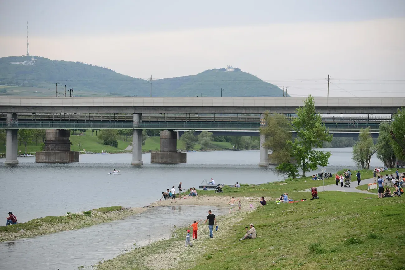 A sandy beach and cycling path along the Neue Donau on Vienna's Danube Island