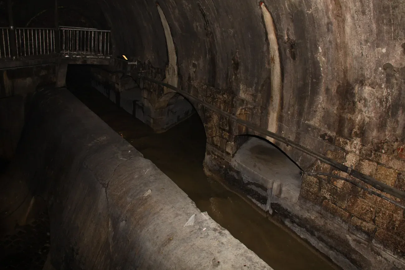 A vaulted brick tunnel in the Vienna sewer network visited on the guided Third Man tour