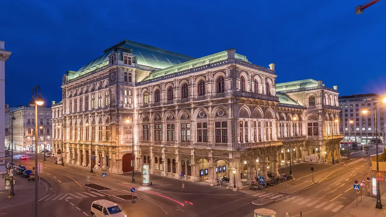 An aerial view of the Vienna State Opera and the Ringstrasse at dusk