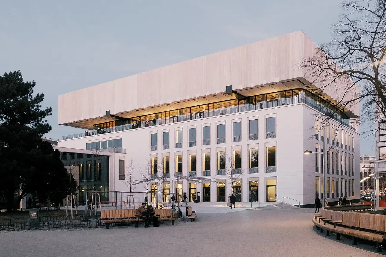 The Wien Museum's modern extension rising over Karlsplatz in Vienna at dusk