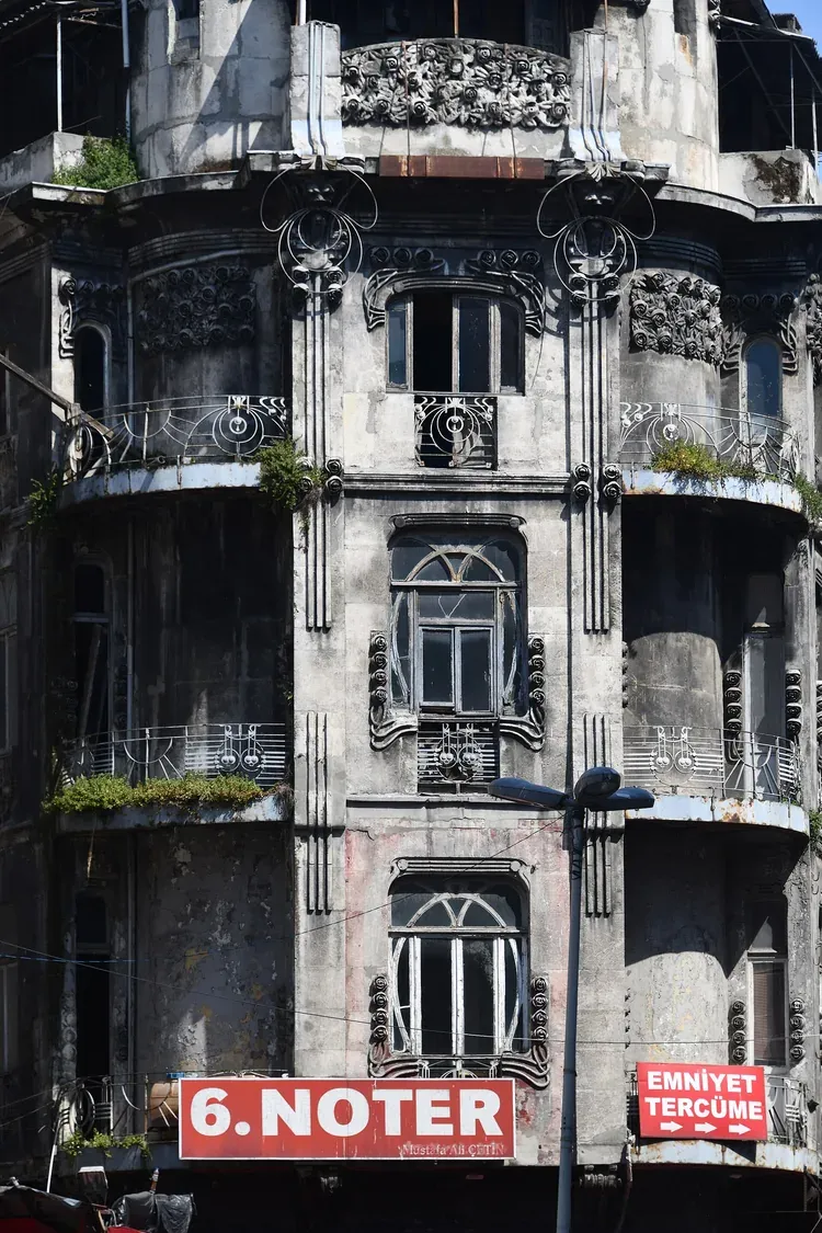 Art Nouveau facade of Vlora Han in Sirkeci, Istanbul, with carved stone roses and wrought iron balconies