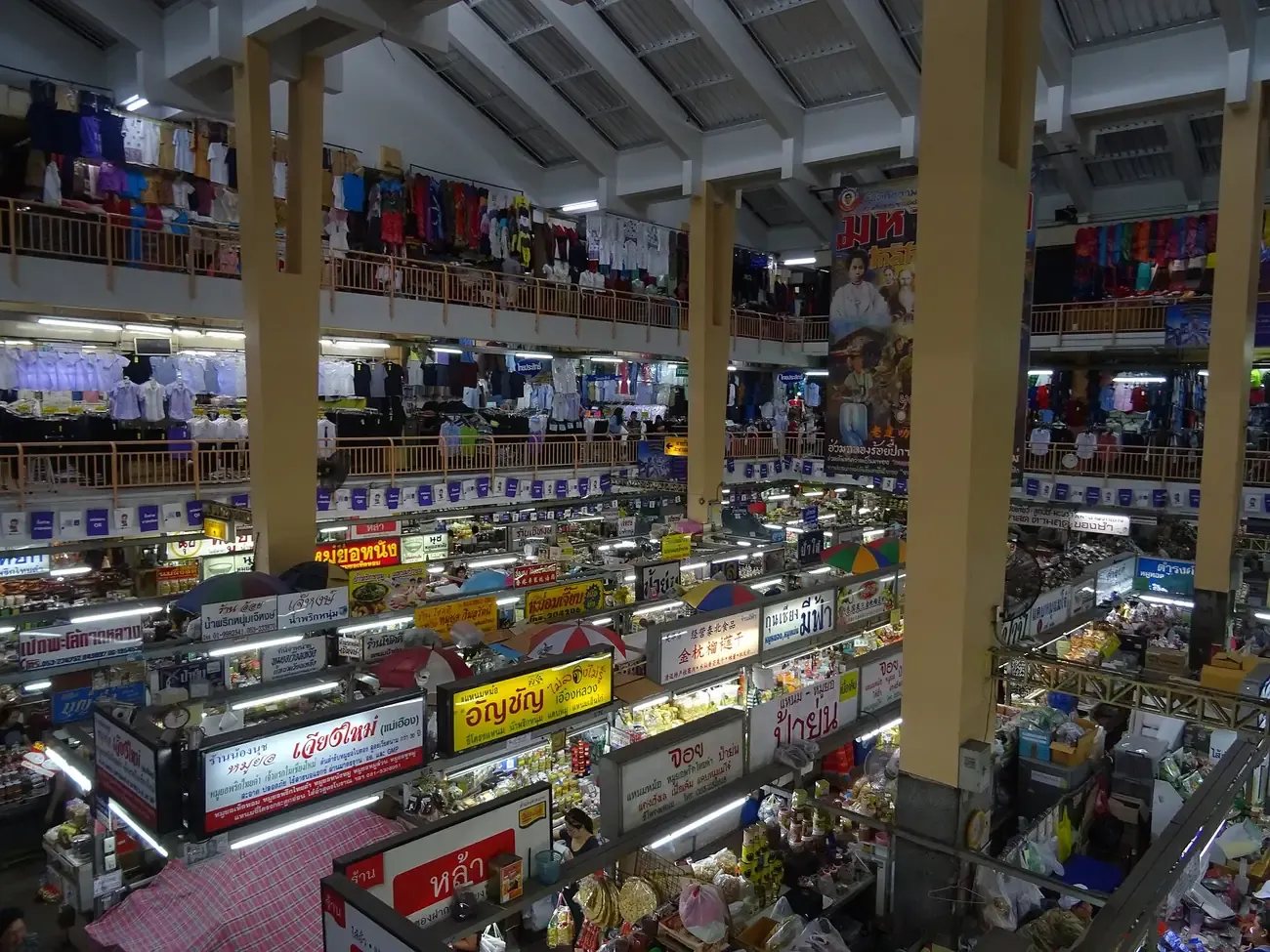 The multi-level interior of Warorot Market with clothing floors above food stalls, Chiang Mai