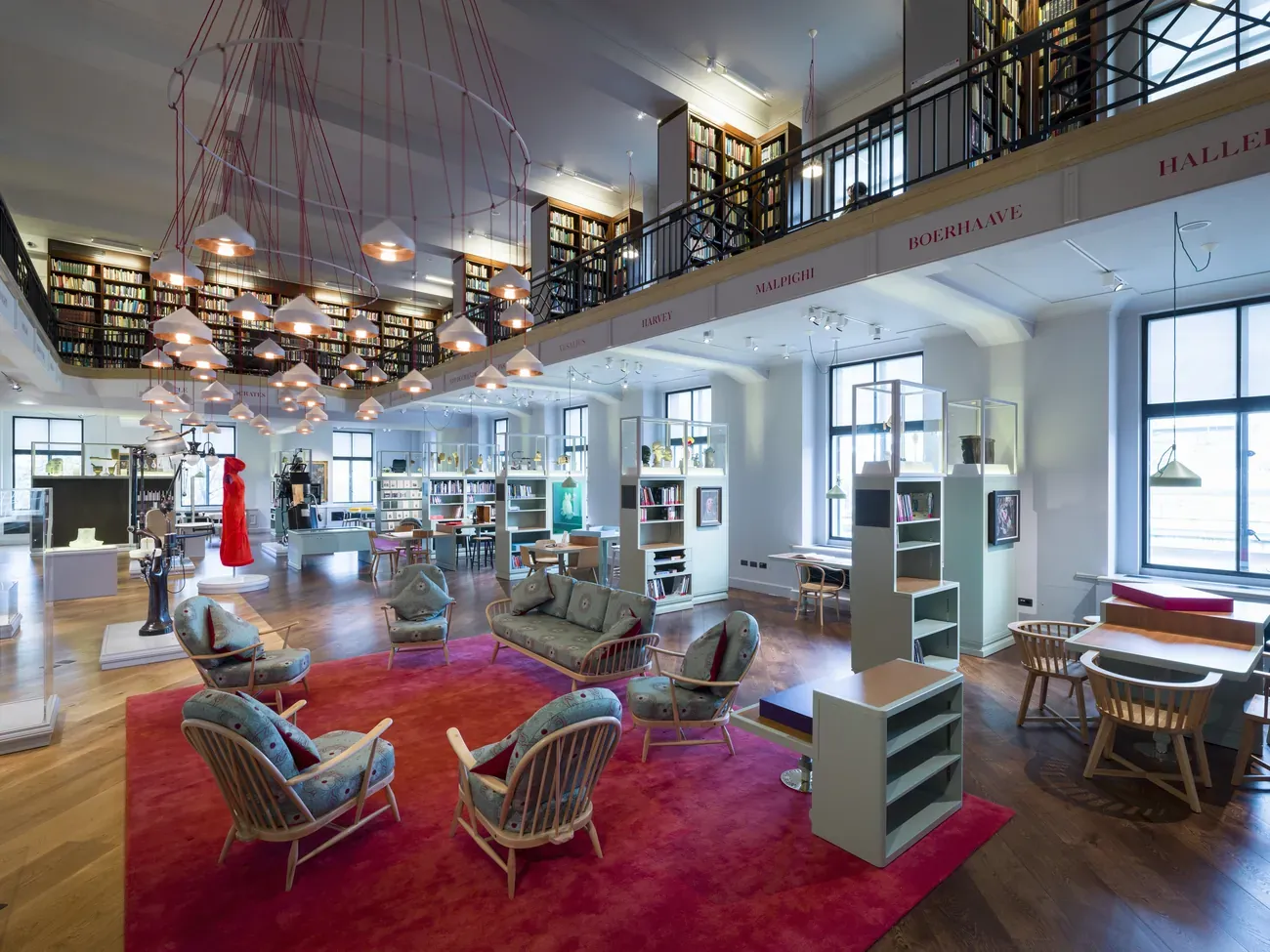 Armchairs, rugs and bookshelves in the Reading Room of Wellcome Collection in London