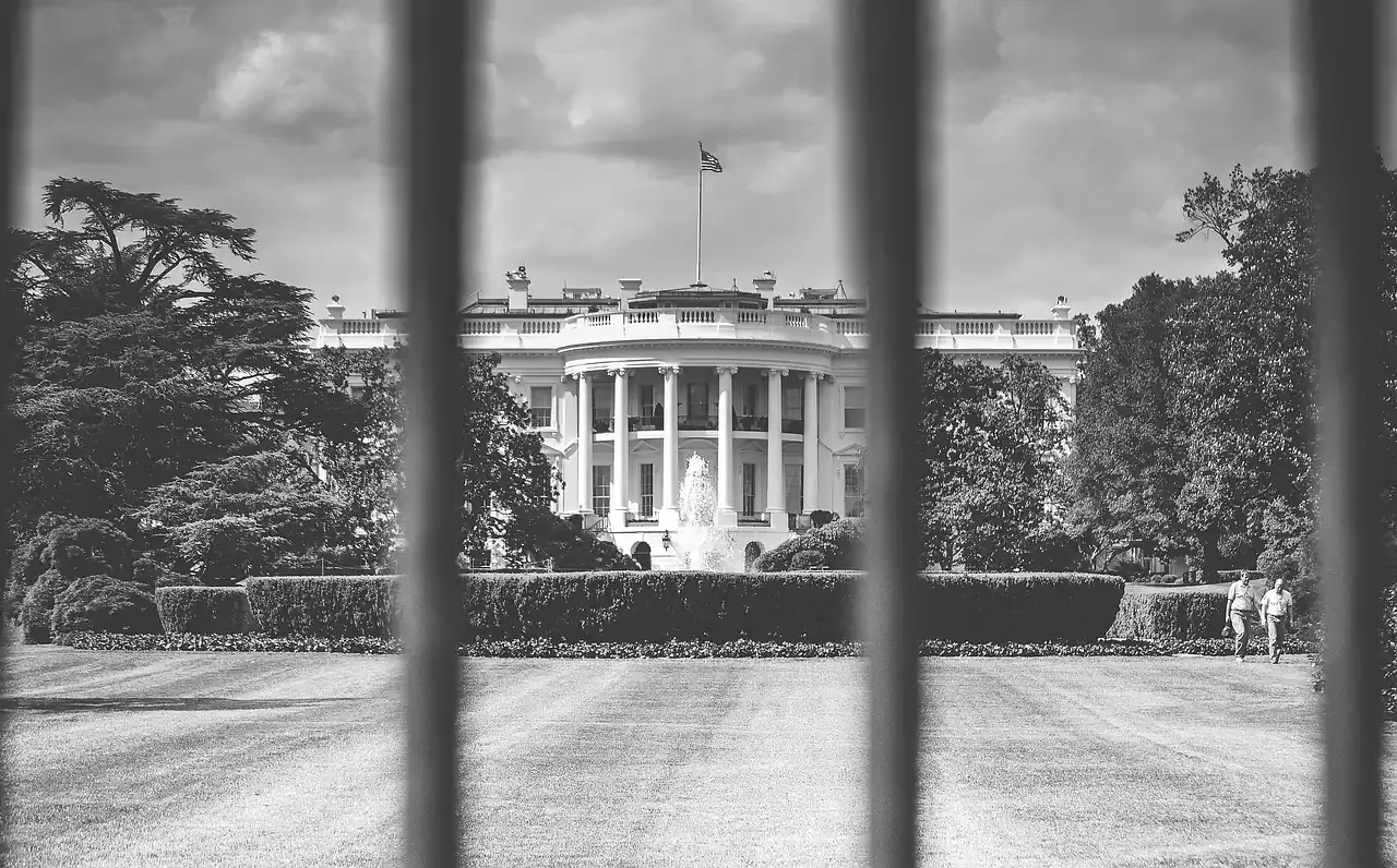 The White House seen through the railings of the perimeter fence in Washington, D.C.
