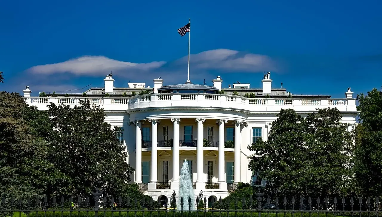 The White House and its lawn behind the fence in Washington, D.C.