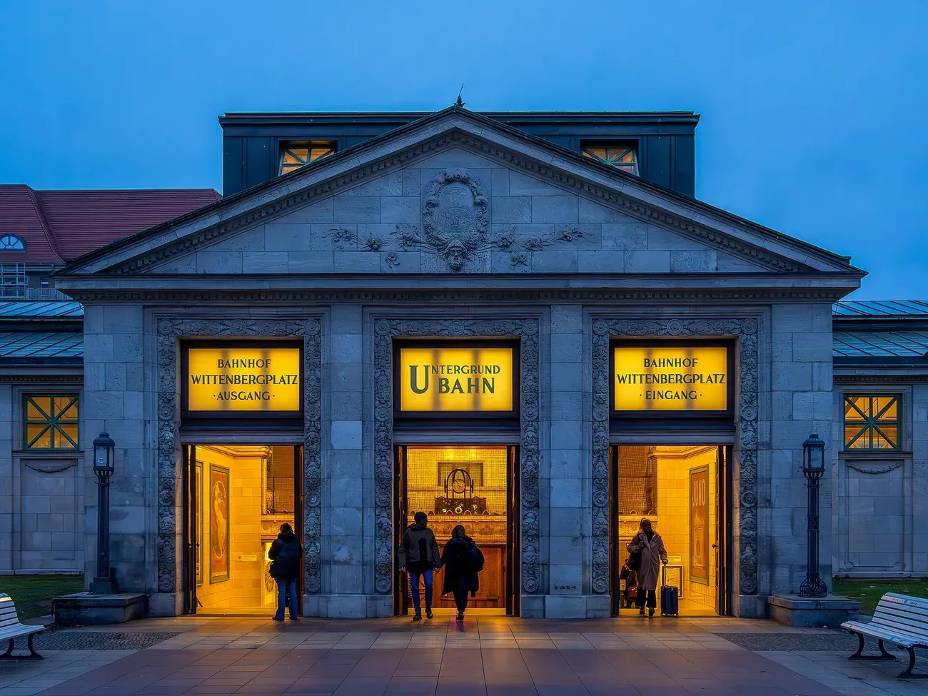 The lit entrance building of Wittenbergplatz U-Bahn station at dusk, Berlin