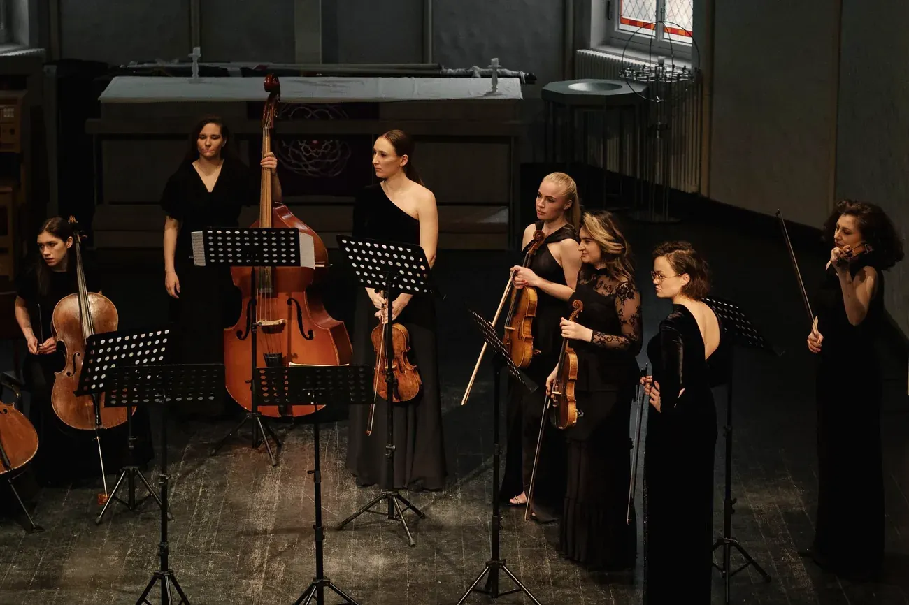 Women's string ensemble performing in concert