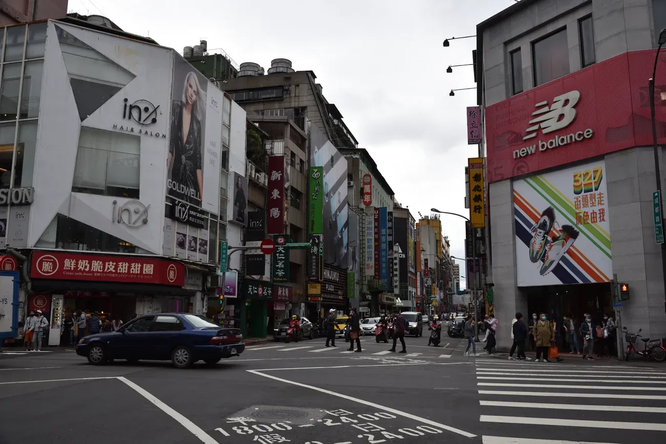 A busy shopping street and crossing in the Ximending district, Taipei