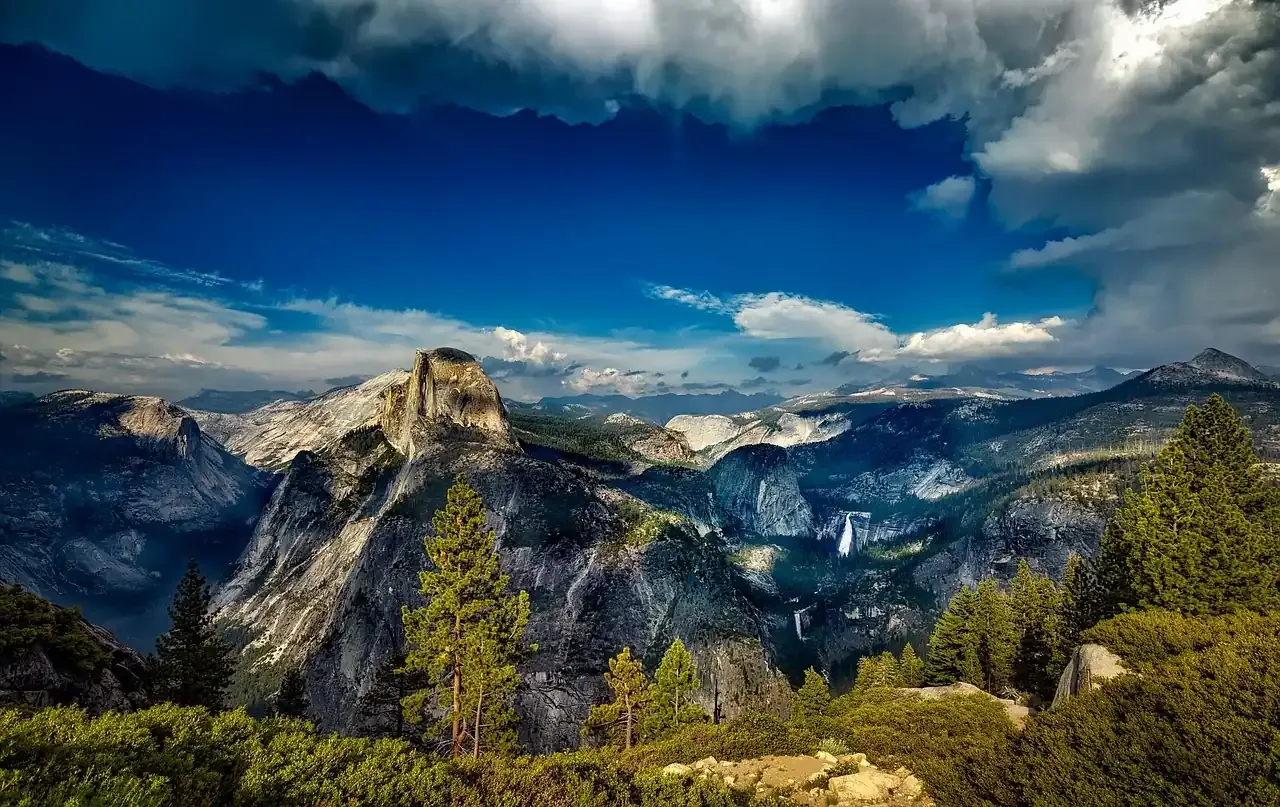 Yosemite Valley and Half Dome under towering clouds in California