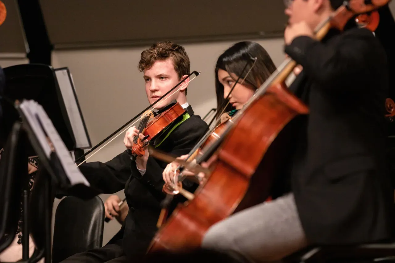 Young musicians playing violin and cello