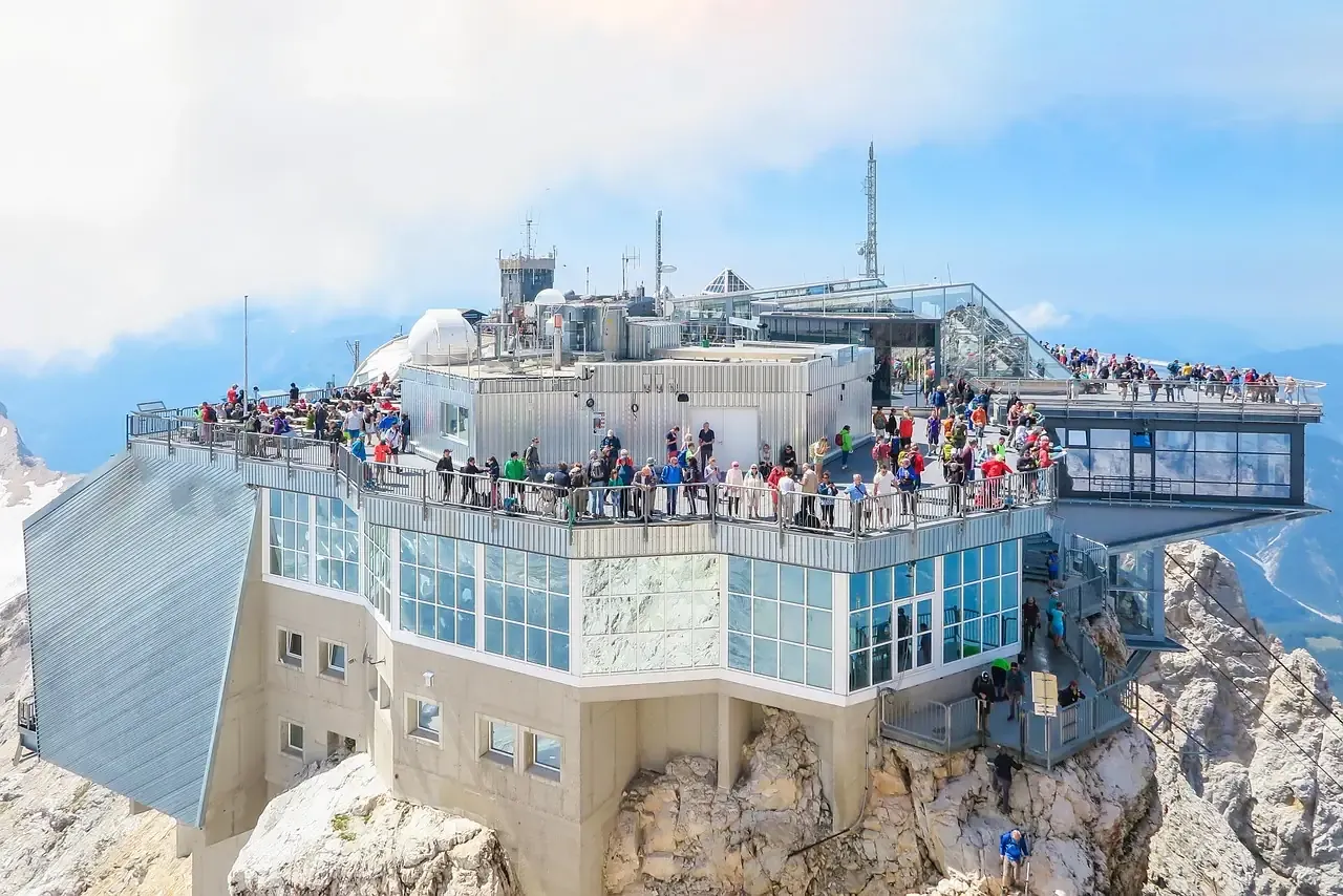 Visitors on the terraces of the summit station on the Zugspitze in Bavaria