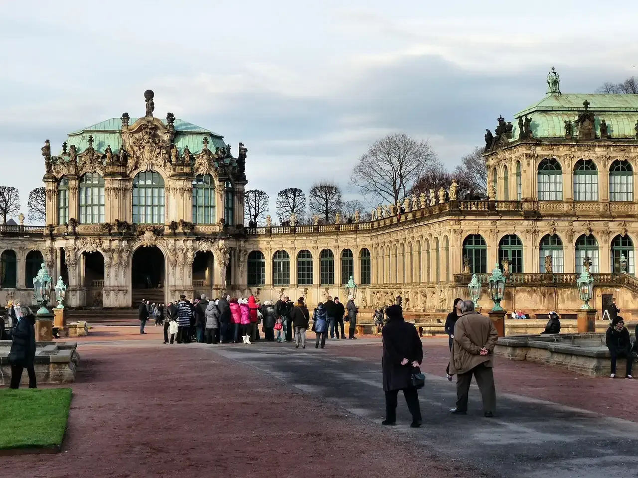Visitors in the courtyard of the Zwinger between its baroque galleries in Dresden
